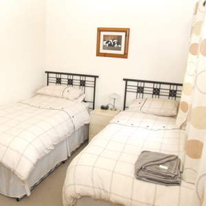 Twin bedroom with ensuite bathroom